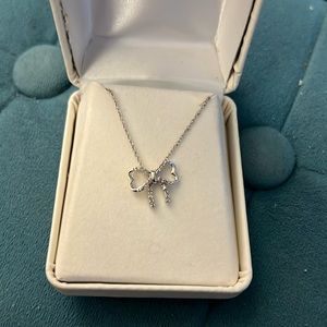 10k white gold and 1/10 ct Diamond bow pendant